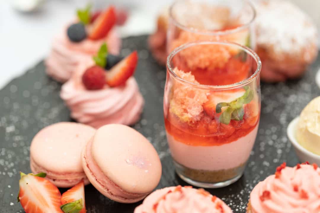 Pink macarons, strawberries & cheesecake Afternoon Tea items
